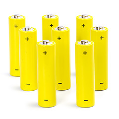 Image showing eight yellow alkaline batteries