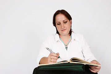 Image showing Businesswoman writing