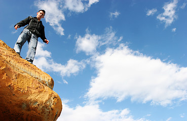 Image showing Man standing on top of the world