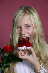 Image showing Girl eating a cake