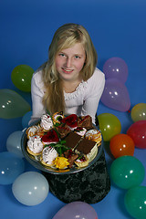 Image showing Girl with cakes
