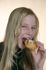 Image showing Girl eating a cake