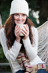 Image showing Beautiful teenager drinking coffee