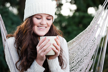 Image showing Beautiful teenager drinking coffee