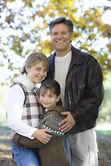 Image showing Father and Daughters