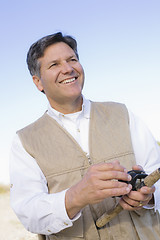 Image showing Man Fishing in River