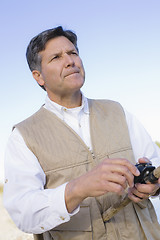 Image showing Man Fishing in River