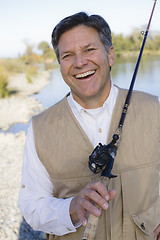 Image showing Man With Fishing Pole