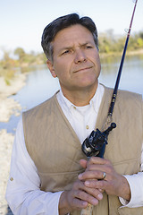 Image showing Man With Fishing Pole