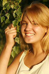 Image showing Young blond girl smiling happily