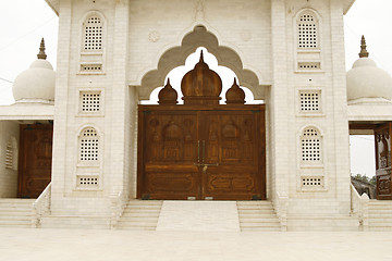 Image showing Beautiful wooden gate to a holy temple in India, Rajasthan regio