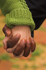 Image showing male & female clasping hands