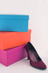 Image showing Shoe boxes and red shoe