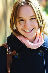 Image showing Happy teenage girl in coat