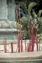 Image showing Burning incense in urn at buddhist pagoda