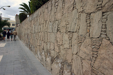 Image showing Walking along a stonewall