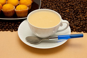 Image showing White cup of coffee and coffee beans