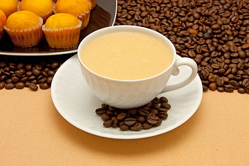 Image showing White cup of coffee and coffee beans