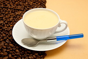Image showing White cup of coffee and coffee beans