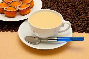 Image showing White cup of coffee and coffee beans