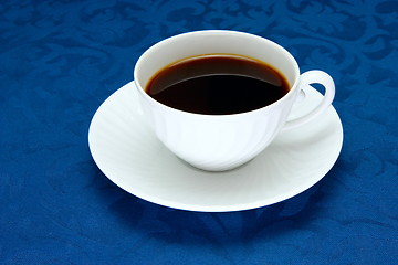 Image showing Cup of  coffee on a blue background