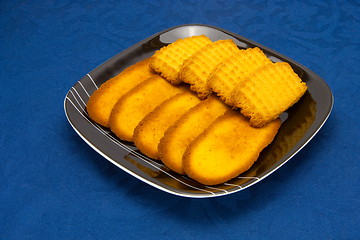 Image showing cookies on a Plate on a blue background