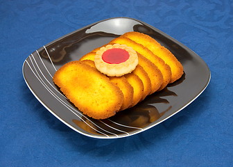 Image showing cookies on a Plate on a blue background 