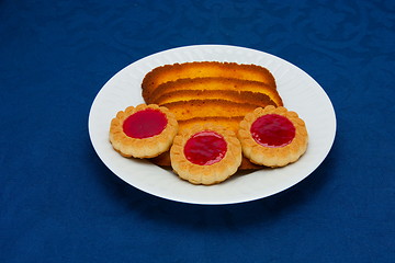 Image showing cookies on a Plate on a blue background 