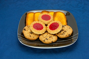 Image showing cookies on a Plate on a blue background