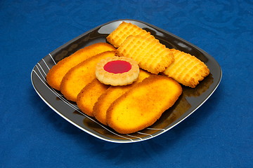 Image showing cookies on a Plate on a blue background