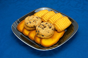 Image showing cookies on a Plate on a blue background