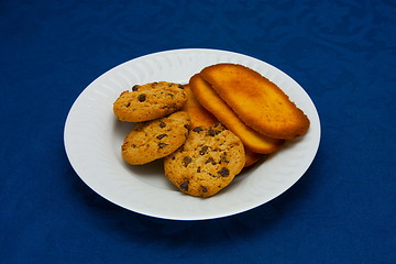 Image showing cookies on a Plate on a blue background