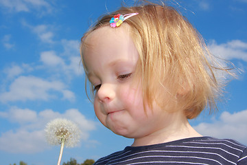 Image showing girl blowing dandelion