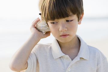 Image showing Boy Holding Shell