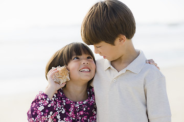 Image showing Two Children With Shell