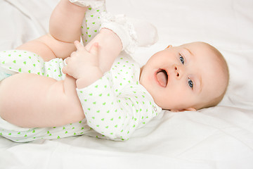 Image showing Baby plays with her legs