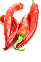 Image showing four red chilly peppers