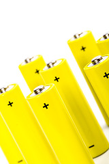 Image showing eight yellow alkaline batteries