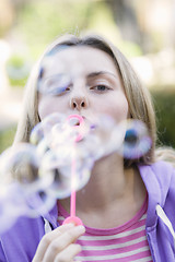 Image showing Teen Girl Blowing Bubbles