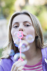 Image showing Teen Girl Blowing Bubbles