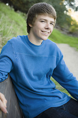 Image showing Teen Boy on Park Bench