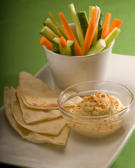 Image showing hummus dip with pita bread and vegetable