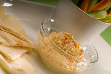 Image showing hummus dip with pita bread and vegetable