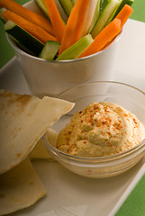 Image showing hummus dip with pita bread and vegetable