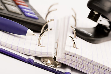 Image showing business organizer, pen, calculator and stapler