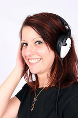 Image showing Woman listening to her favorite music