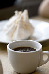 Image showing cup of coffee and meringue