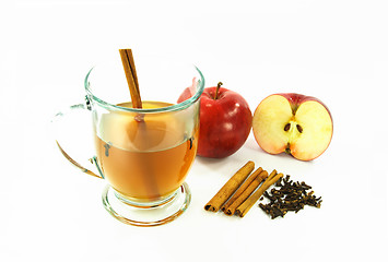 Image showing Hot apple cider in glass over white. 