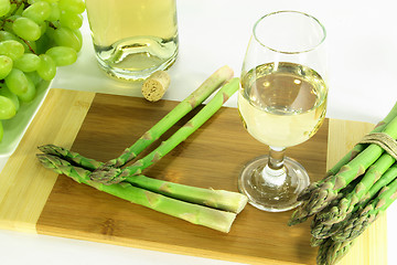 Image showing Glass of white wine and sides. 