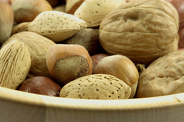 Image showing Assorted nuts in wooden bowl. 